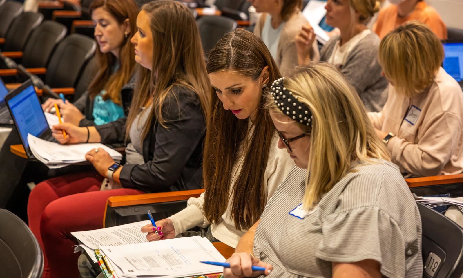 Teachers work together during a professional development session